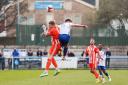 Benni Smales-Braithwaite (10) jumps up for a header  with a Lancaster player. Photo: via Guiseley