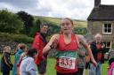 Ilkley Harrier Lucy Haines spints for the line at the Arncliffe Fell Race. Picture: Dave Woodhead