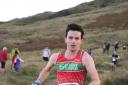 Ilkley Harriers' Rob Cunningham battles through the mud in the Shepherds Skyline race    Picture: woodentops.org.uk