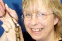 Burley Parish Council chairman Caroline Jones with the necklace.