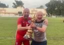 Rob Pell (left) and Mark Smitheringale (right) celebrate with the trophy