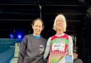 Hilda Coulsey receiving her age category prize from British long distance runner Jo Pavey MBE, at the Antrim Coast Half Marathon. Photo credit: Hilda Coulsey