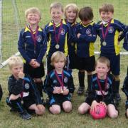 Ilkley Juniors under-sixes with their trophbies from the Burley Trojans' Junior Tournament