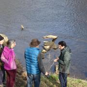 Alex Sobel with representatives of Ilkley Clean River Group at the River Wharfe in Otley