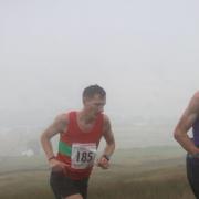 Ben Rothery on his way to winning in the mist at Chapelfell Top