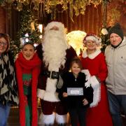 The Machell family with Santa and his elves at Otley Garden Centre