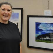 Josie Michelle whose painting won first place for favourite picture chosen by the visitors over the weekend