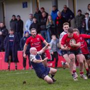 Ilkley (red) endured a difficult trip to league leaders York. Photo: Peter W. Clark