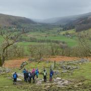 An approaching rainstorm in Upper Wharfedale viewed by a group of walkers from the grassy terrace above Hubberholme Woods just north of Buckden, taken by Philip Robins, of Addingham