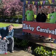 Ilkley BID’s chair Ian White (right) joins primary beneficiary AWARE volunteer Rachel Miller (centre) Ilkley Carnival chair Andrew Stacey (left) and AWARE members George McKerchar