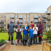 Menston Primary School children enjoy planting at The Spindles, a local retirement community