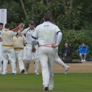 Pudsey St Lawrence v Woodlands Jordan Thompson, second left, helpts to celebrate a wicket