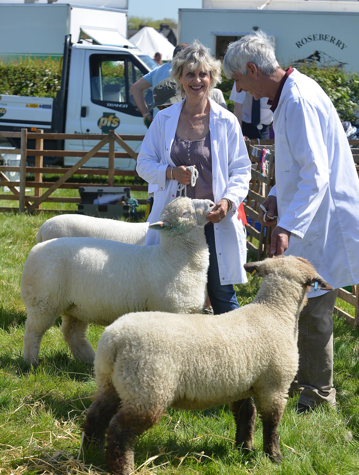Two exhibitors at Otley Show share a joke.