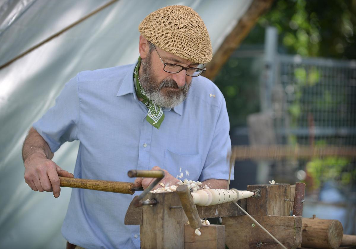 Richard Law puts a display of traditional carpentry skills and wood turning.  