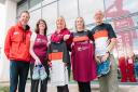 Members of The Marches School Oswestry 10k organising committee, Dave Newton, Ellen Harrison, Ashling Donohue-Harrison and Ray Pickett with Helen Knight