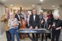 New residents, visitors and staff at Summer Manor in Burley-in-Wharfedale listen to the music at the cheese and wine event
(l-r) Brian and Sue Goodall, Paul Grainger (double bass), David and Cherrill (correct) Hollebon (correct), Stuart Collingwood