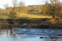 A high river over the stepping stones at Burley-in-Wharfedale