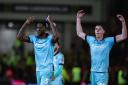 Bolton Wanderers' Ricardo Santos and Eoin Toal celebrate with fans