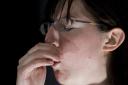 Photo of a woman coughing
