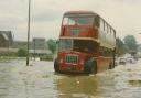 Struggling on along a flooded Yeadon road in 1968
