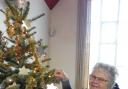 Adding stars to the tree in Addingham Methodist Church