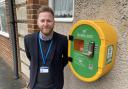 Guiseley and Rawdon Councillor, Paul Alderson with the new defibrillator at Greenacre Hall in Rawdon