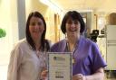 Danielle Longworth, left, patient service manager for theatres, anaesthetics and ICU at Airedale Hospital, and Karen Burnett, hospital data manager at Airedale for the National Joint Registry, with the award