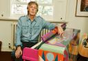 Paul McCartney sat at the ‘Magic Piano’ that was painted by Dudley Edwards © Mary McCartney
