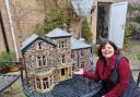 Ceri Carter with the model of the Sue Ryder Wheatfields Hospice
