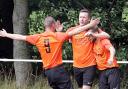 Bobby Neesam, right, celebrating the opening goal with Chris Crellin and Otley Town's number 9 Ben Mcardle