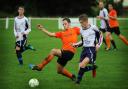 Otley Town's Harry Leigh (orange shirt) worked hard to keep Newsome's pacy attack at bay
