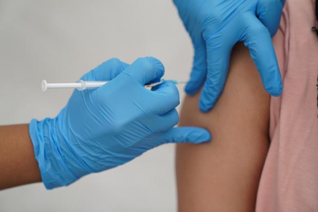 Ilkley Gazette: A person getting the vaccine. Credit: PA