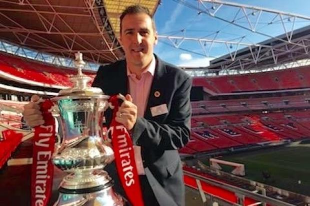 Guiseley Community Foundation Development manager Steve Taylor, pictured here with the FA Cup at the Twinning Project initiative at Wembley, needs someone to work alongside him.