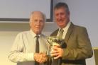 Paul Newbould (right) receives his award from league president Alan Broadbent.