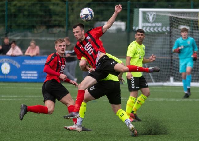 Action from a clash between Campion (red and black) and Steeton earlier this season. Picture: John Chapman.