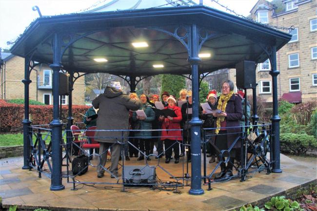 Ilkley Choral Society singing Christmas carols at the bandstand on The Grove on Sunday