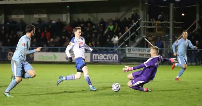 Adam Haw (white) was the man to assist Jordan Thewlis for Guiseley's goal. Picture: Alex Daniel.
