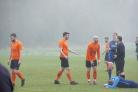 Otley Town players (orange) contest a decision given by the referee. Pic: Nicola Driffield