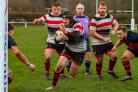 Ilkley (red and white) battled heroically to claim victory on Saturday. Pic: Peter W. Clark