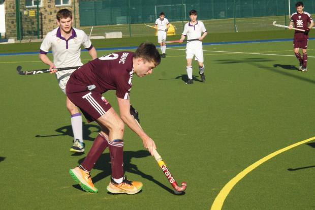 Ross McMillan (red) scored for the men's team on Saturday Pic:SONY DSC