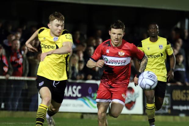 Guiseley (yellow) pulled off a huge victory on Tuesday night. Pic: Peter Short