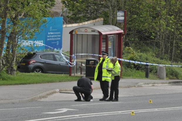 Ilkley Gazette: Police investigating at the scene in Horsforth