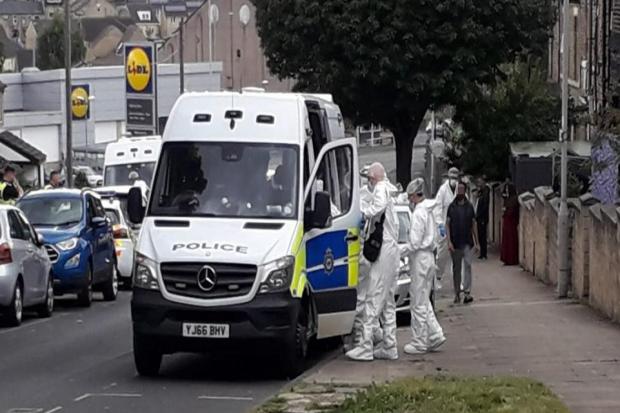 A police presence, including a forensics team, carried out investigations on Harewood Street, Barkerend, today
