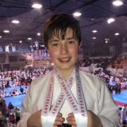 James Smith with his two gold medals wrapped around his neck