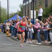 Nathan Edmondson going through Otley on his way to winning the Rob Burrow Leeds Marathon. Photo credit: Tracy Russell