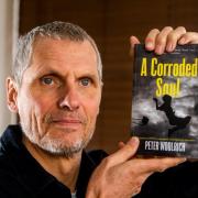 Peter Woolrich with his book A Corroded Soul