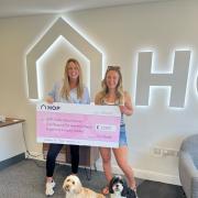 Left to right is Abi Noble from HOP with competition winner Grace Gordon and her dogs