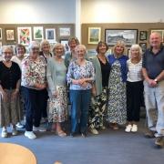 Members of the Monday art class at the Clarke Foley Centre in Ilkley, in front of their exhibition