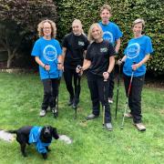 Natasha Loveridge (second from right) with family and friends who will be joining her on the trek up Scafell Pike, supported by team mascot Olive the Dog