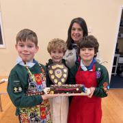 The winning team was made up of Henry (age 10), Eddie (age 8), William (age 9) who are pictured her with Assistant District commissioner, Maz Jennings.